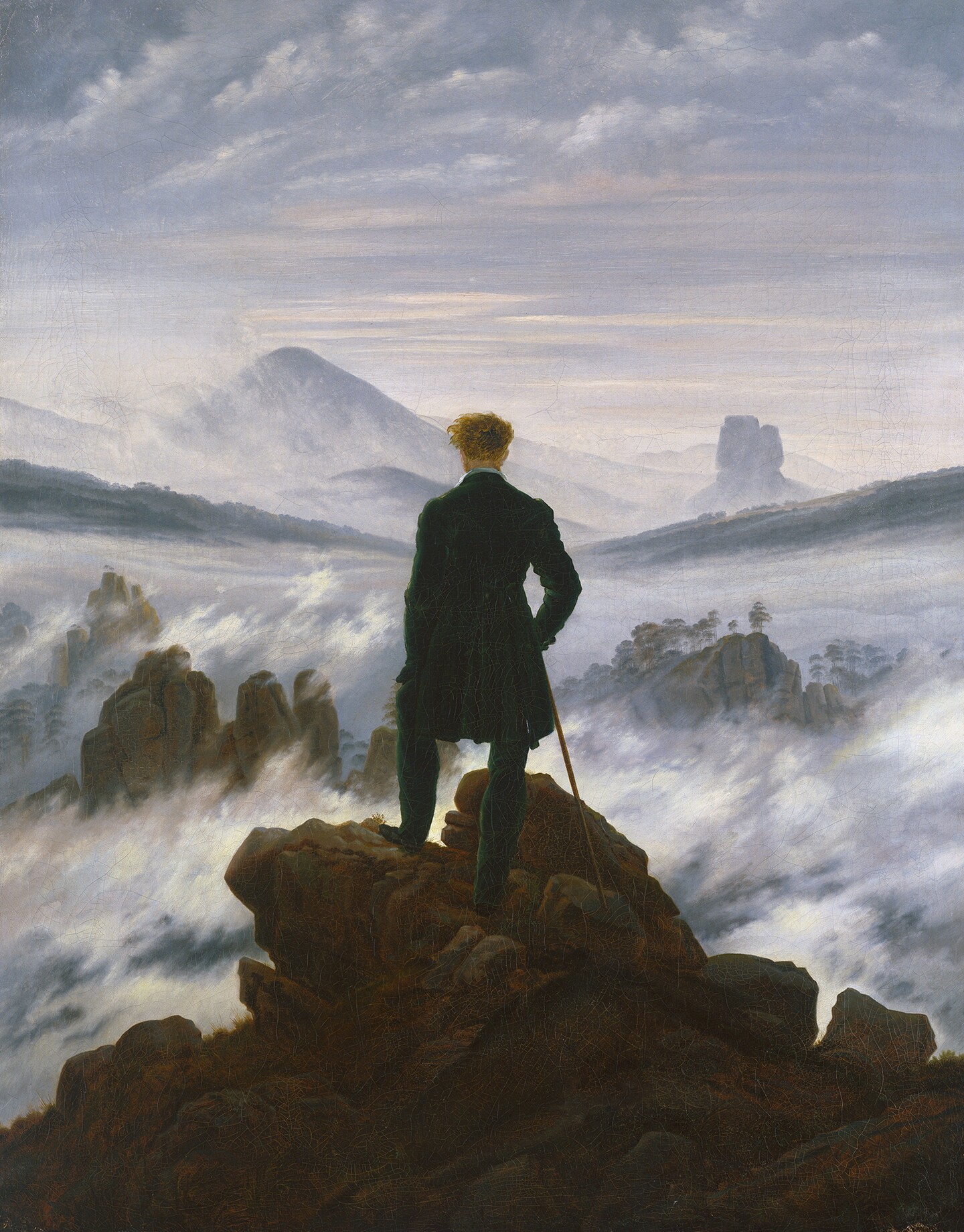 <Gemälde eines Mannes in dunklem Anzug, der auf Felsen über einem Nebelmeer mit Bergpanorama steht